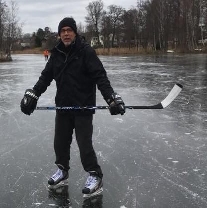 Buck playing hockey