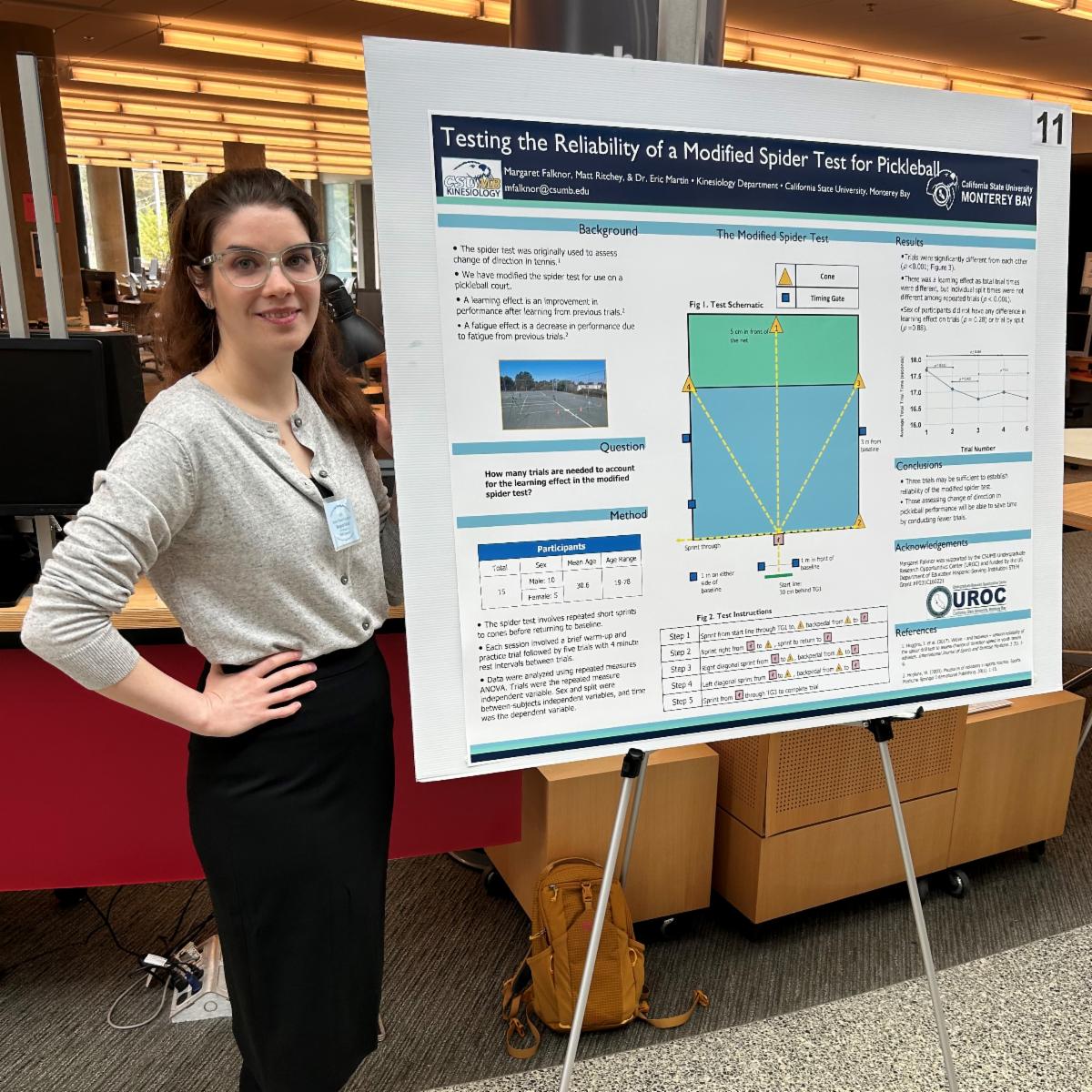 Margaret in front of her poster