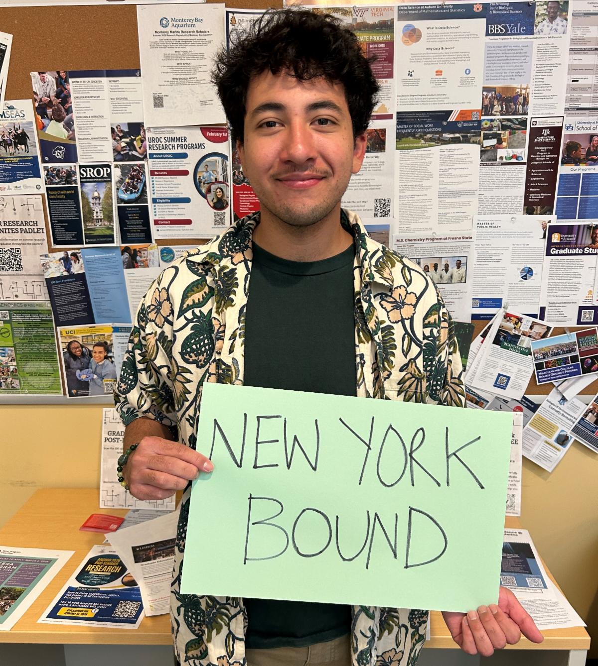 Andres Ramirez holds sign