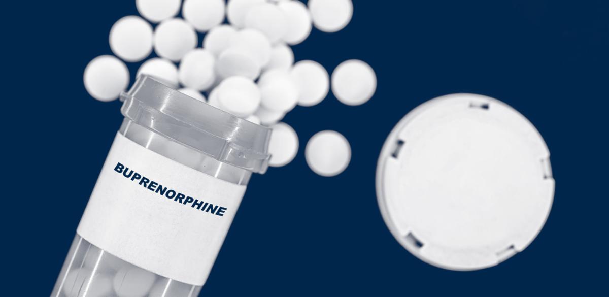 bottle of buprenorphine pills spilling out