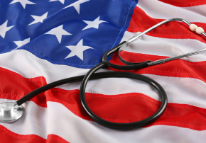 A stethoscope on top of an American flag