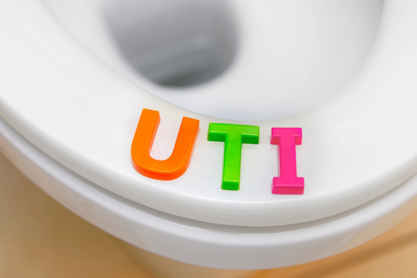 "UTI" letter blocks on toilet seat