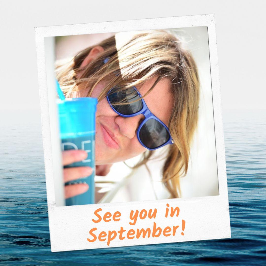 A smiling person with blonde hair and blue sunglasses is holding a blue cup and appears against a backdrop of calm water The text See you in September is written at the bottom of a Polaroid-style photo