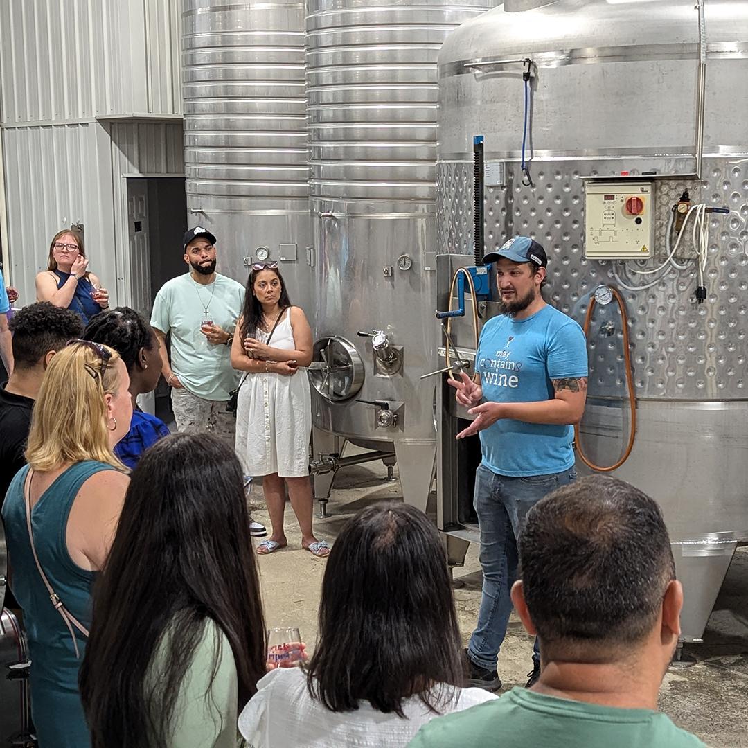 Clover Hill assistant winemaker leading tour of tank room