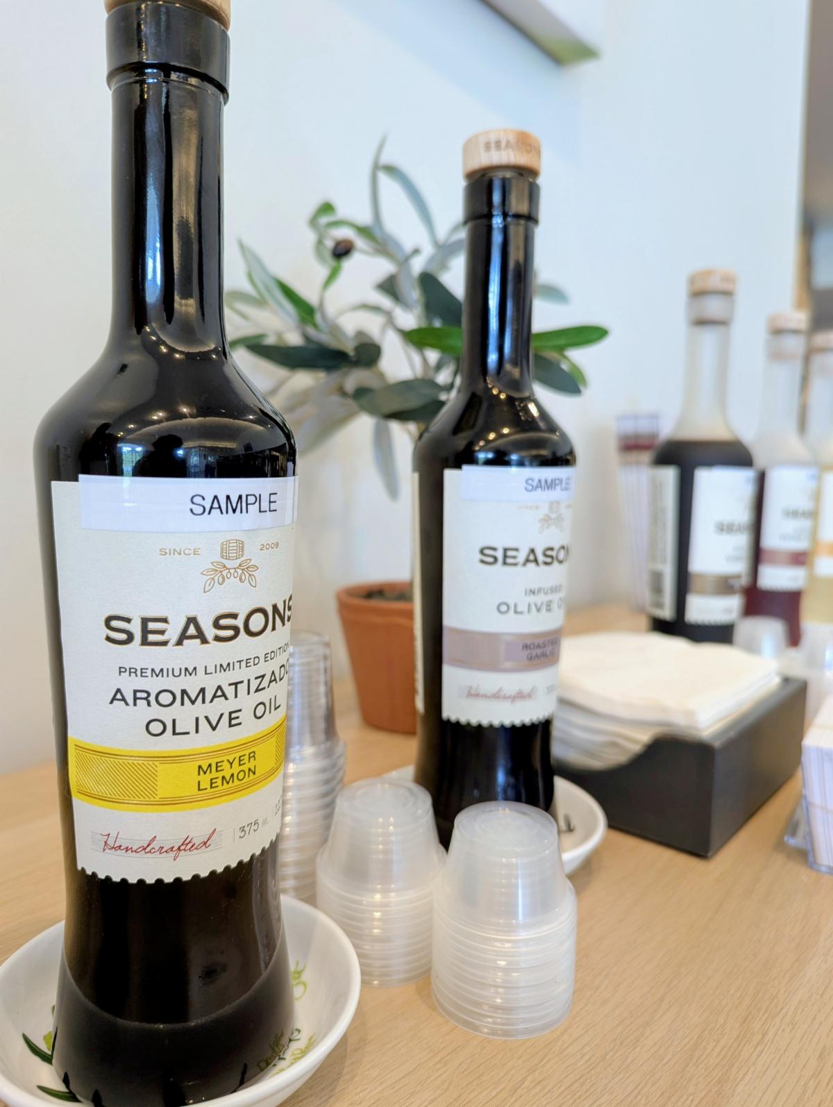 Bottles of Seasons Olive Oils on display for tasting