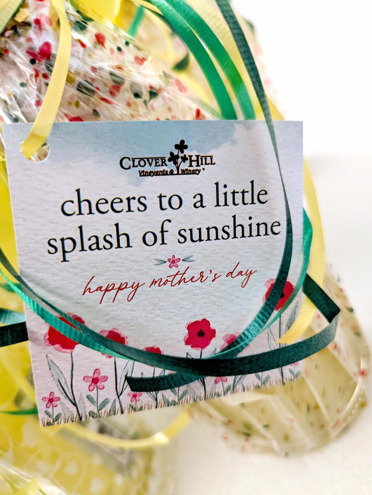 Tag that says 'cheers to a little splash of sunshine' tied to a bottle of Limoncello