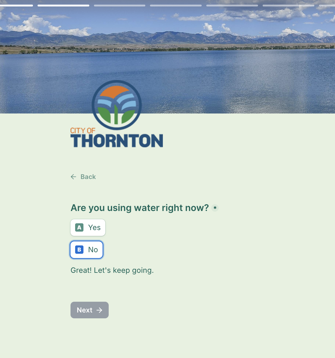 Quiz screenshot, with a light green background, city of Thornton logo, and an image with blue water and a mountain range in the distance. Text reads: “Are you using water right now?” A button for “No” is highlighted, with text that reads: “Great! Let’s keep going.”