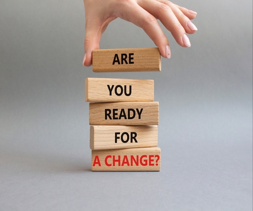 Change symbol. Wooden blocks with words Are you ready for a new change. Businessman hand. Beautiful grey background. Business and change concept. Copy space.