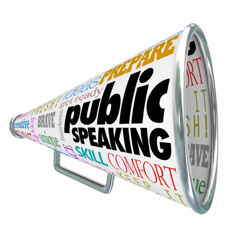 Public Speaking words on a 3d bullhorn or megaphone offering advice_ tips or expert training on delivering a speech at an event or meeting