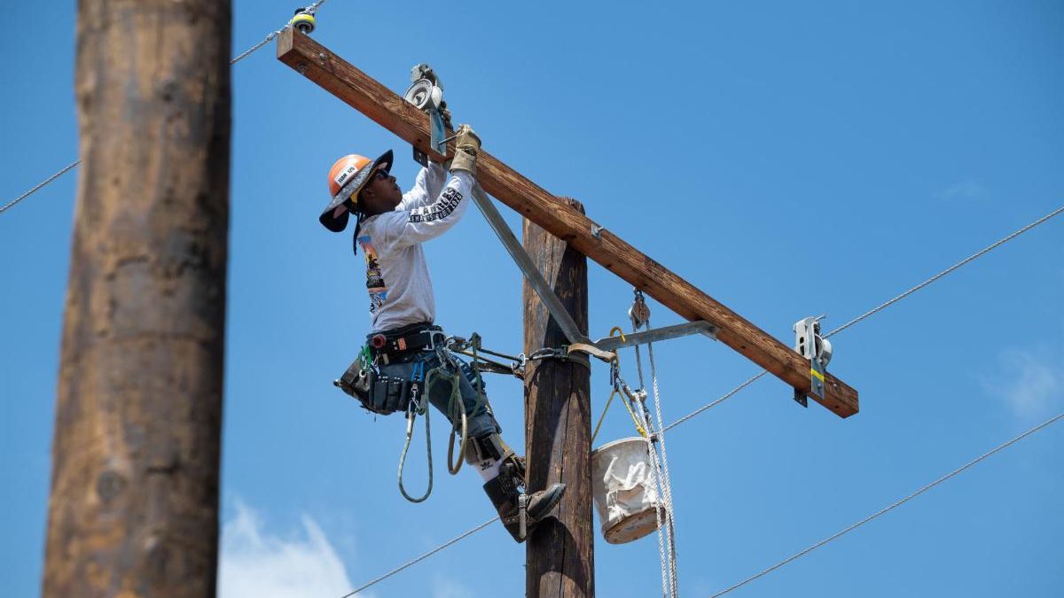 An LADWP lineworker climbs a utility pole during a competition event at the 34th Annual Lineman’s Rodeo.