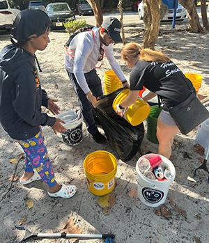 people participating in a beach cleanup