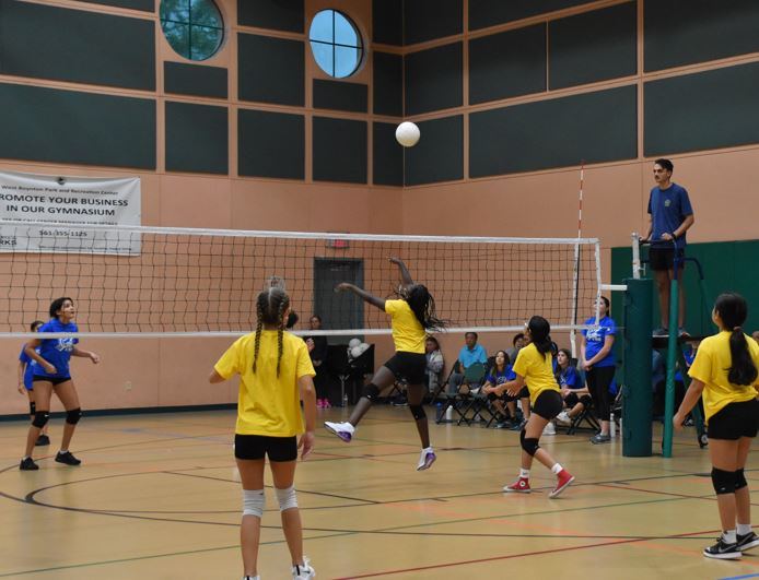 youth playing volleyball