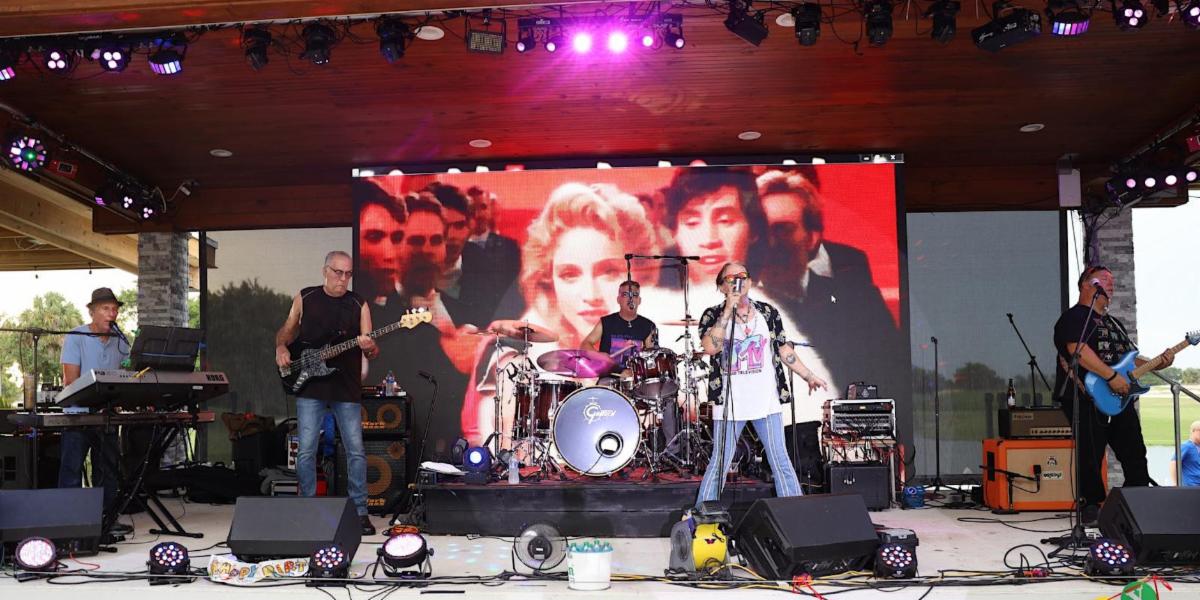 Image of The MTVJ's band performing on a stage