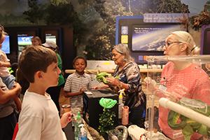 children talking with adults about animals and nature