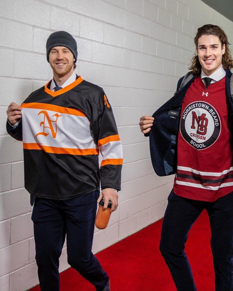 New Jersey Devils defenseman Damon Severson wears a Middletown North ice hockey jersey ahead of the Lions appearance in the NJSIAA Public B State Championship game.