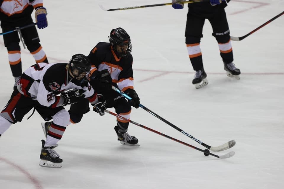 The Middletown North ice hockey team battles for the puck with Northern Highlands skaters during the NJSIAA Public B State Championship game at the Prudential Center in Newark.