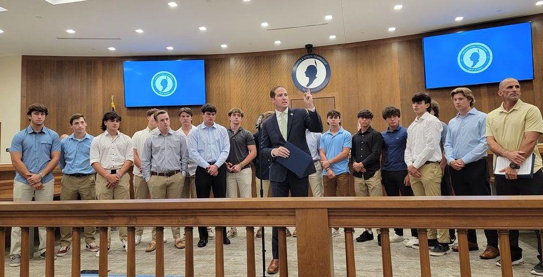 Mayor Tony Perry presents the High School North baseball program with a proclamation celebrating the Lions state championship victory over Cranford.