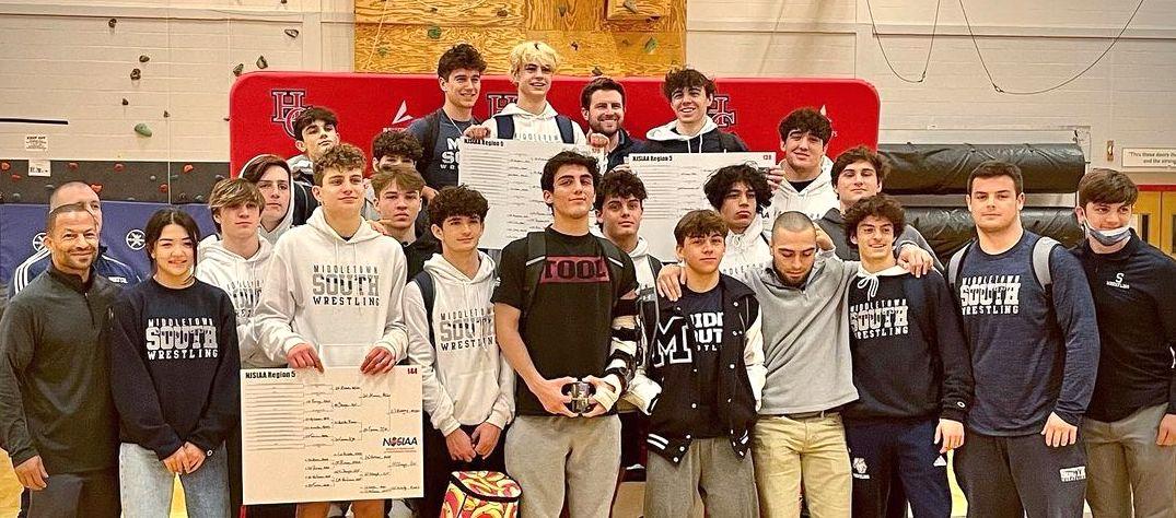 The Middletown South wrestling team celebrates their performance at the Region 5 championship meet.