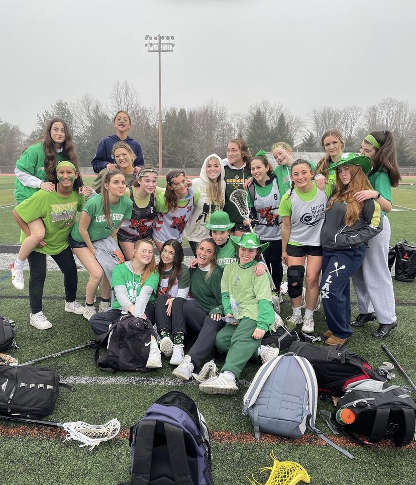 The High School North girls lacrosse team wore green pants, shirts, headbands, and hats during their practice on St. Patrick's Day.