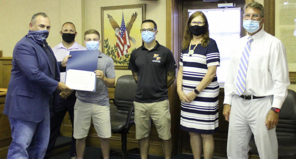 A photo of Deputy Mayor Anthony Fiore, Coach Matt Sirchio, Tyler Klinsky, Coach Eric Morely, Dr. Patricia Cartier and Superintendent of Schools, William O. George III, Ed. D. 