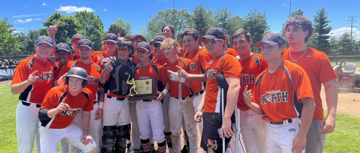 The Lions celebrate their state championship victory over Cranford.