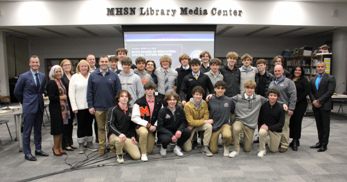 The MTPS Board of Education and Administration honors the High School North hockey program in the Middletown North media center following the Lions' Public B State Championship victory.