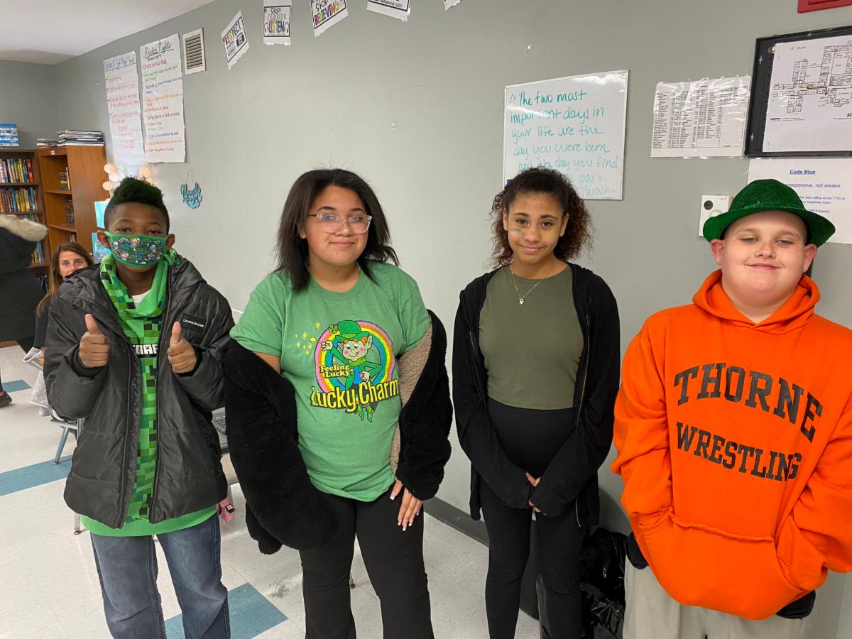 Thorne middle school students wear green clothing and green hats in celebration of St. Patrick's Day.