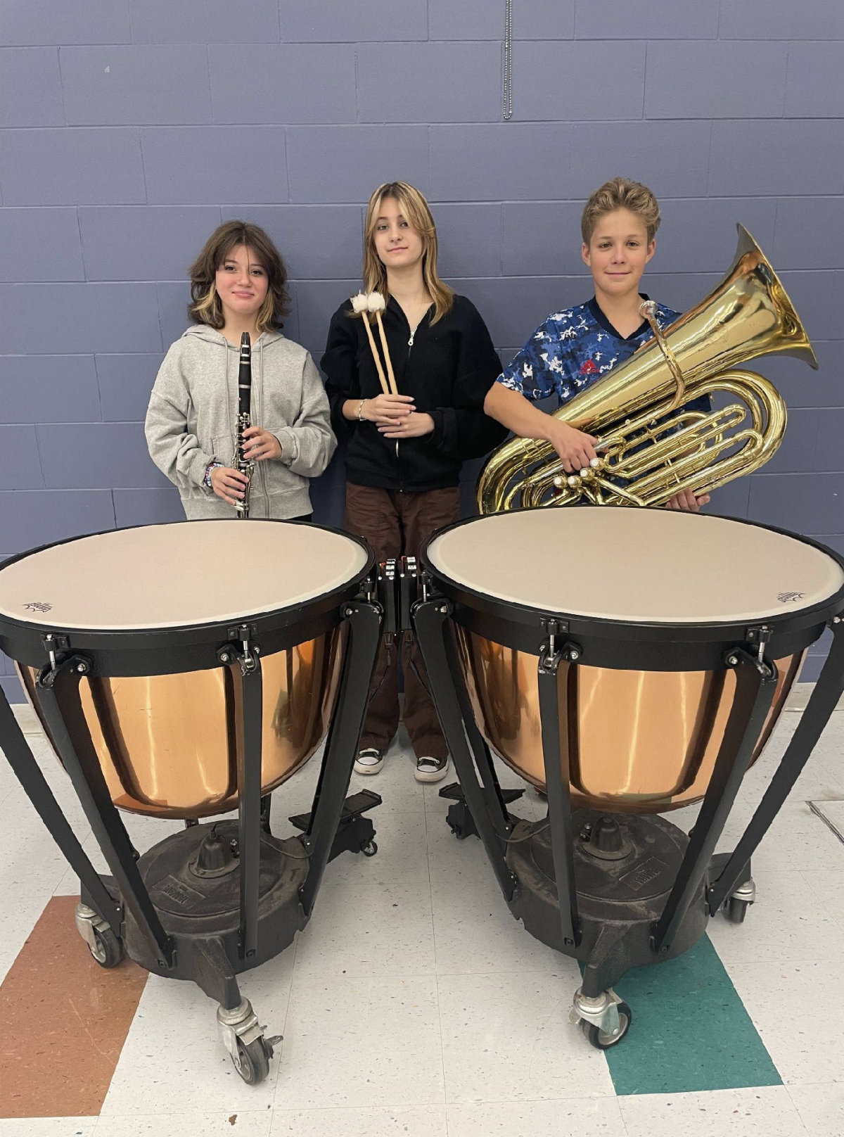 Bayshore Middle School students James Noll, Ashley Pedersen and Keya Steiner celebrate their qualification for the All-Shore Intermediate Band.