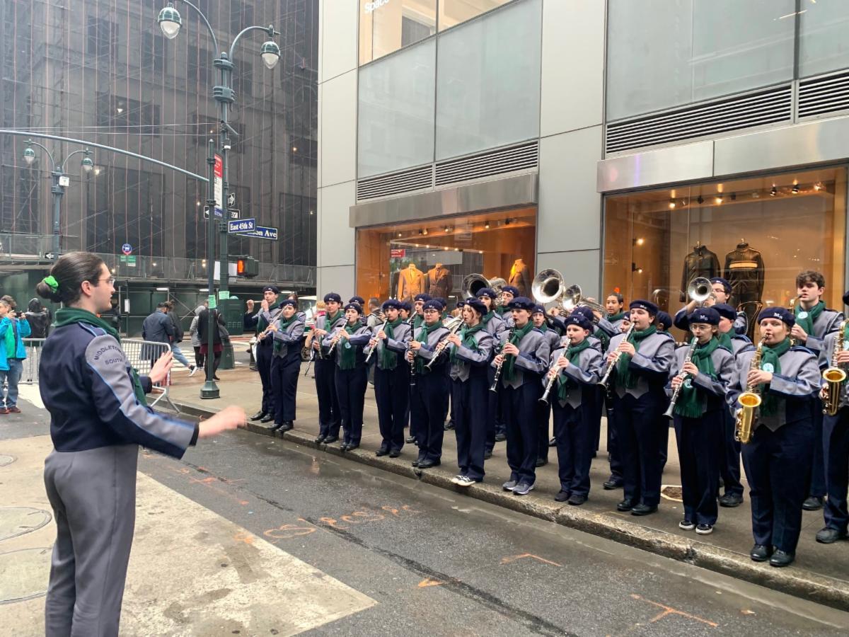 Members of the High School South marching band warm up on their instruments before the New York City St. Patrick's Day Parade.