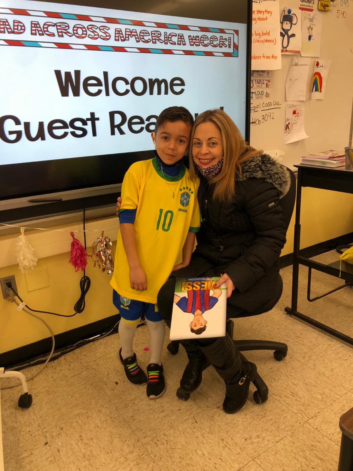 This image shows and elementary school student posing with their mother and favorite book for Read Across America Day.