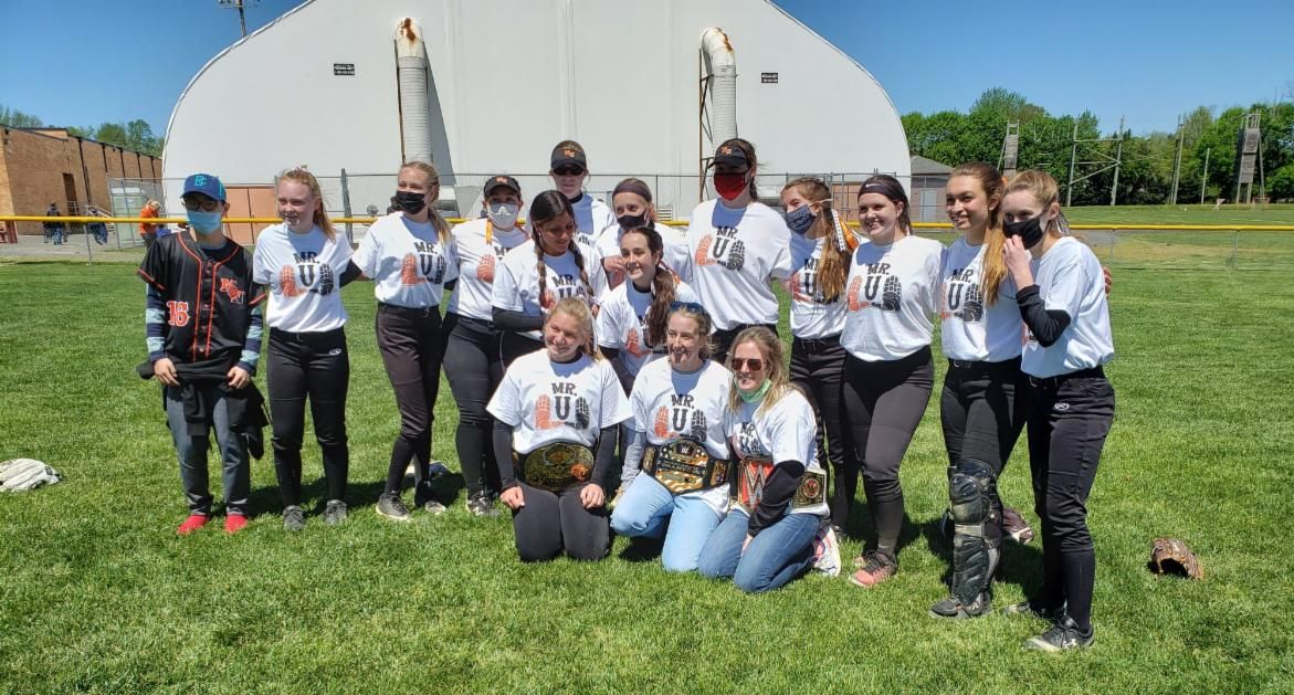Rick Unterstein's daughters, Allison and Erin, pose with the High School North softball program following the the Lions' Rick Unterstein Invitational win over Red Bank Regional.