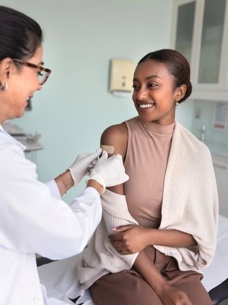 Syringe and vaccine bottle on white background