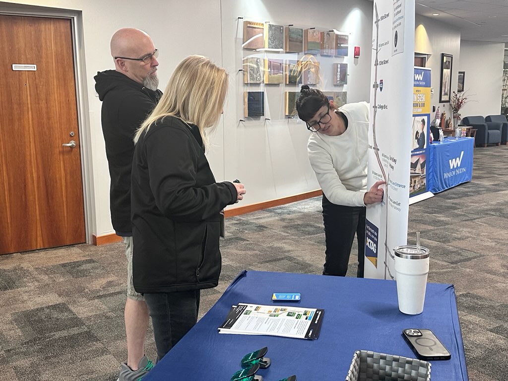 A project team member shares 69Express information at the Matt Ross Community Center in early November 2025. 