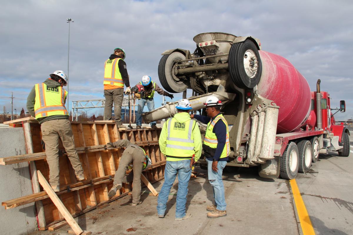 Crews pouring concrete barriers at 119th Street.