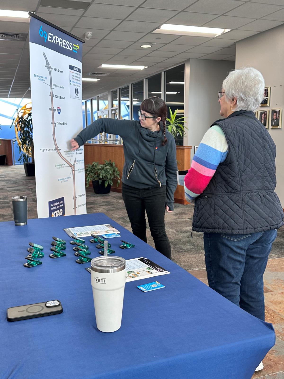 Project team members share 69Express information at Matt Ross Community Center at the Overland Park Farmers’ Market in November 2025.