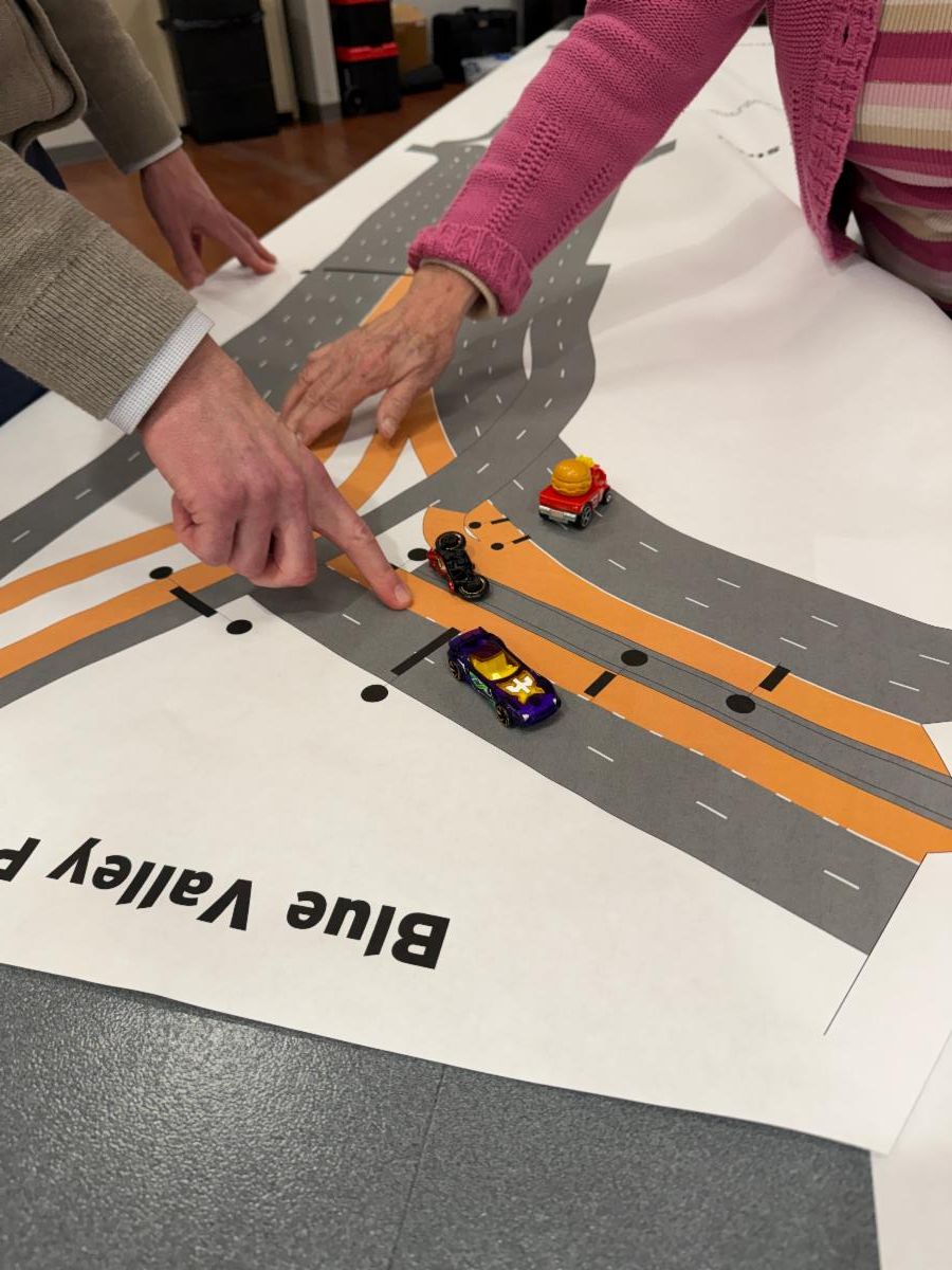 Attendees “drive” the corridor in an interactive table display at the 69Express public open house.