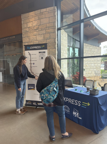 Project team members share 69Express information at the Overland Park Arboretum in October 2025. 