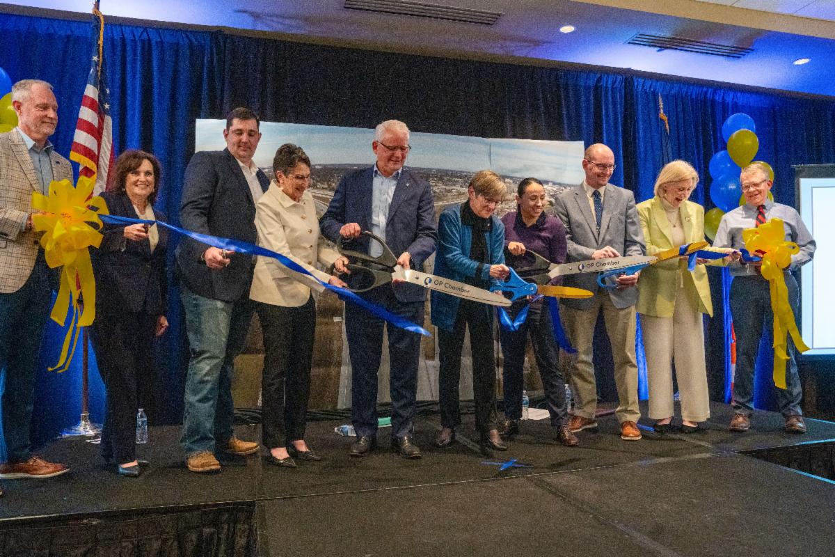 Image of ribbon cutting at ceremony with elected officials, project partners and community leaders.