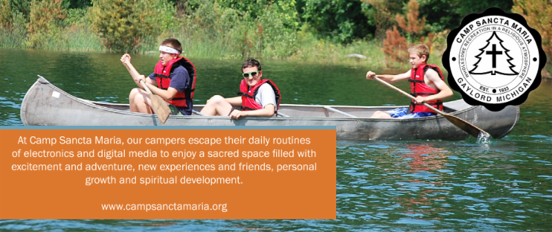 Boys in Canoe with logo and mission statement