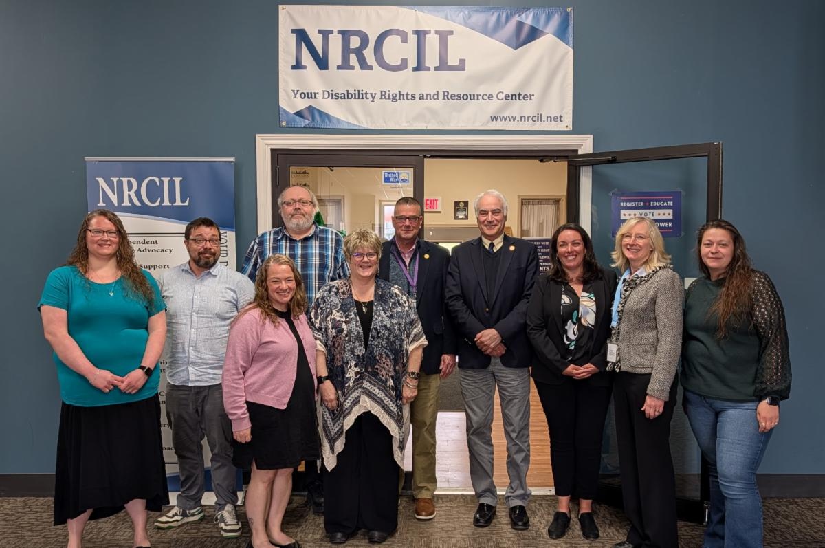 Staff and leadership from the Northern Regional Center for Independent Living (NRCIL) pose for a group photo with New York State Regent Roger Catania during a visit to learn about Independent Living services and disability advocacy efforts in Northern New York.