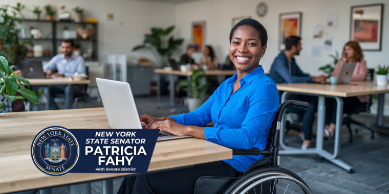 Woman wheelchair user with laptop at desk