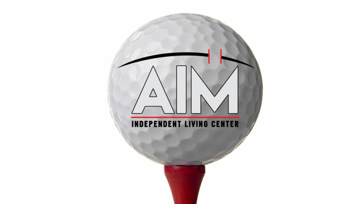 Golf ball on a red tee with the AIM text logo across the ball| AIM Independent Living Center
