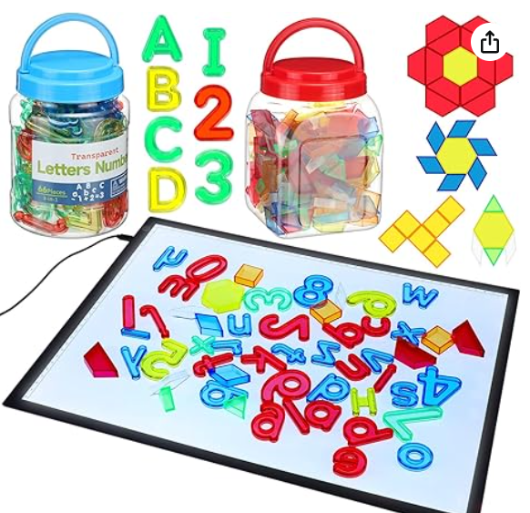 light table with translucent letters numbers and shapes in red yellow blue and green 