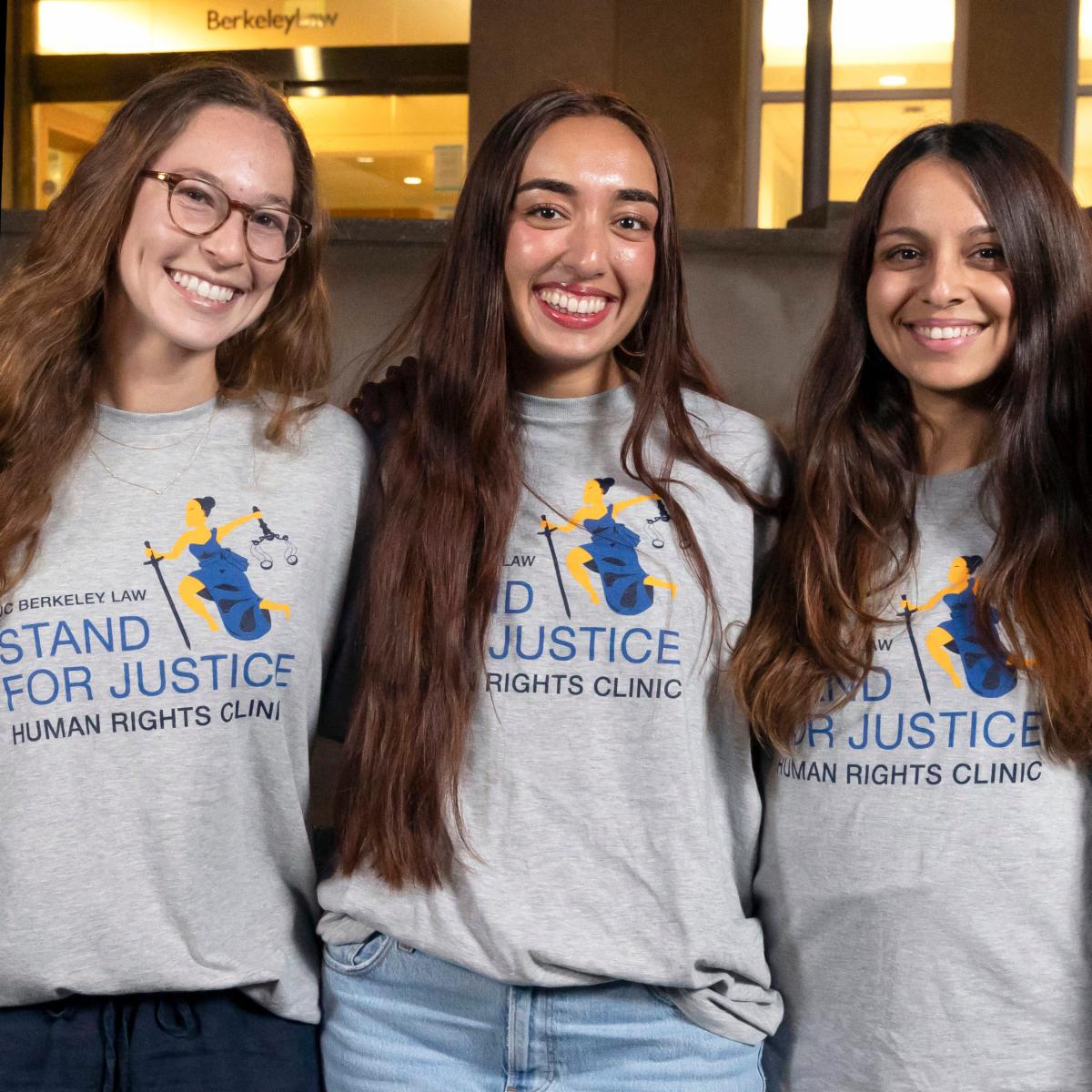 3 students with Stand for Justice T-shirts