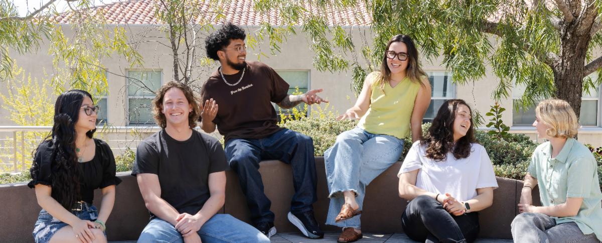PAC 1L students sitting in the courtyard