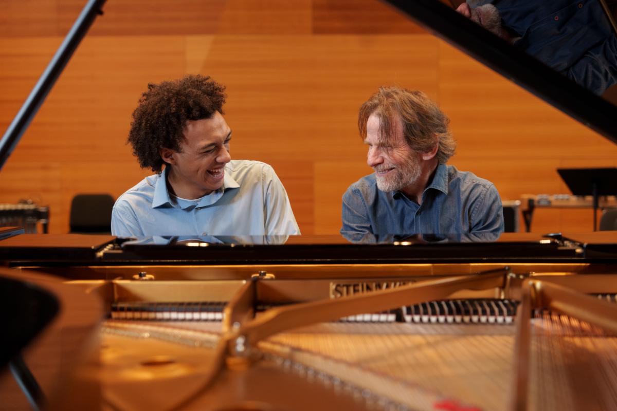 Senior Toussaint Santicola Jones and thesis adviser Steve Mackey at the piano