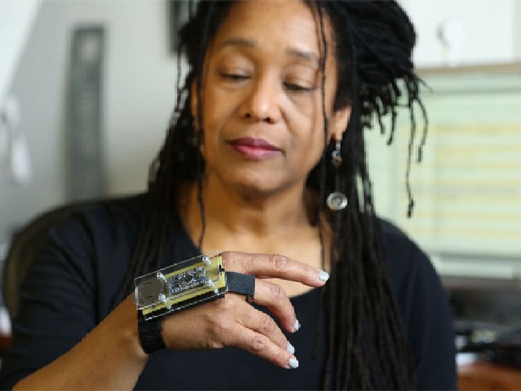 Pamela Z with an electronic instrument on her hand