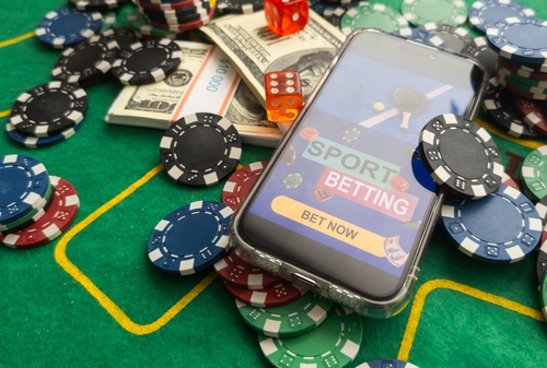 Gambling online casino Internet betting concept green screen. smartphone with poker chips_ dice. Jackpot_ casino chips.