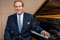 Richard Dowling at a piano