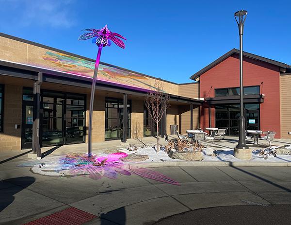 new colorful floral art piece in front of the active adult center